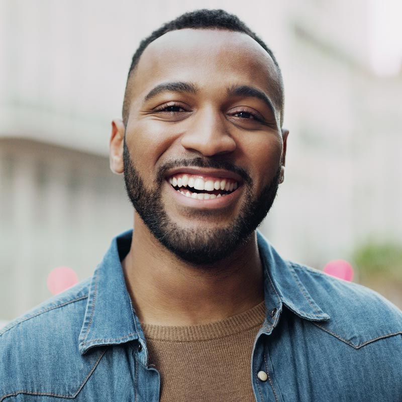 Portrait of a handsome young man in the city
